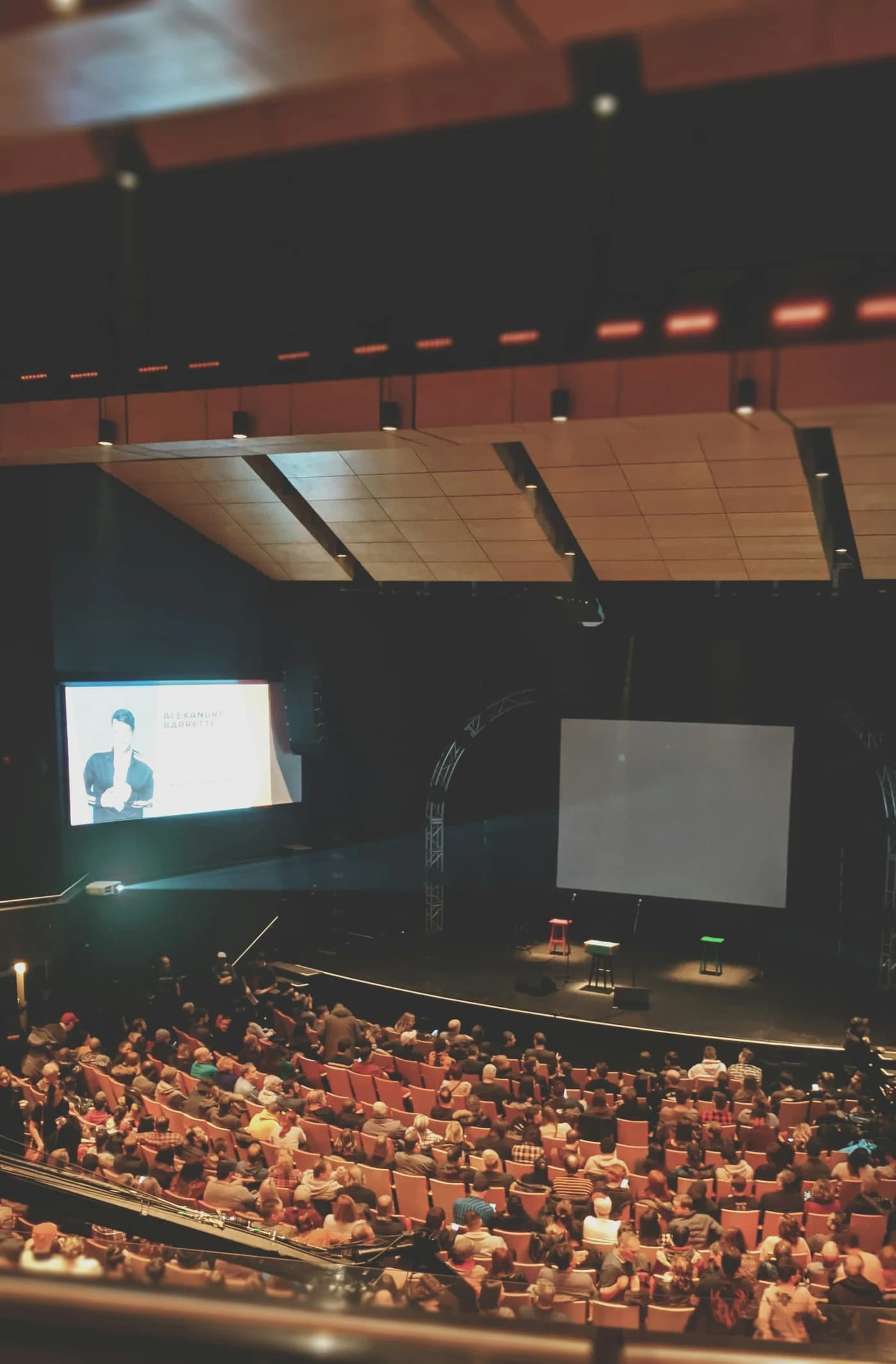 Executives networking on stage at a corporate conference